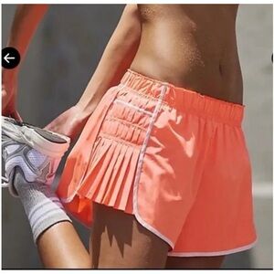 623. FREE PEOPLE Easy Tiger Pleated Shorts in Neon Coral Combo Sz M NWOT $48